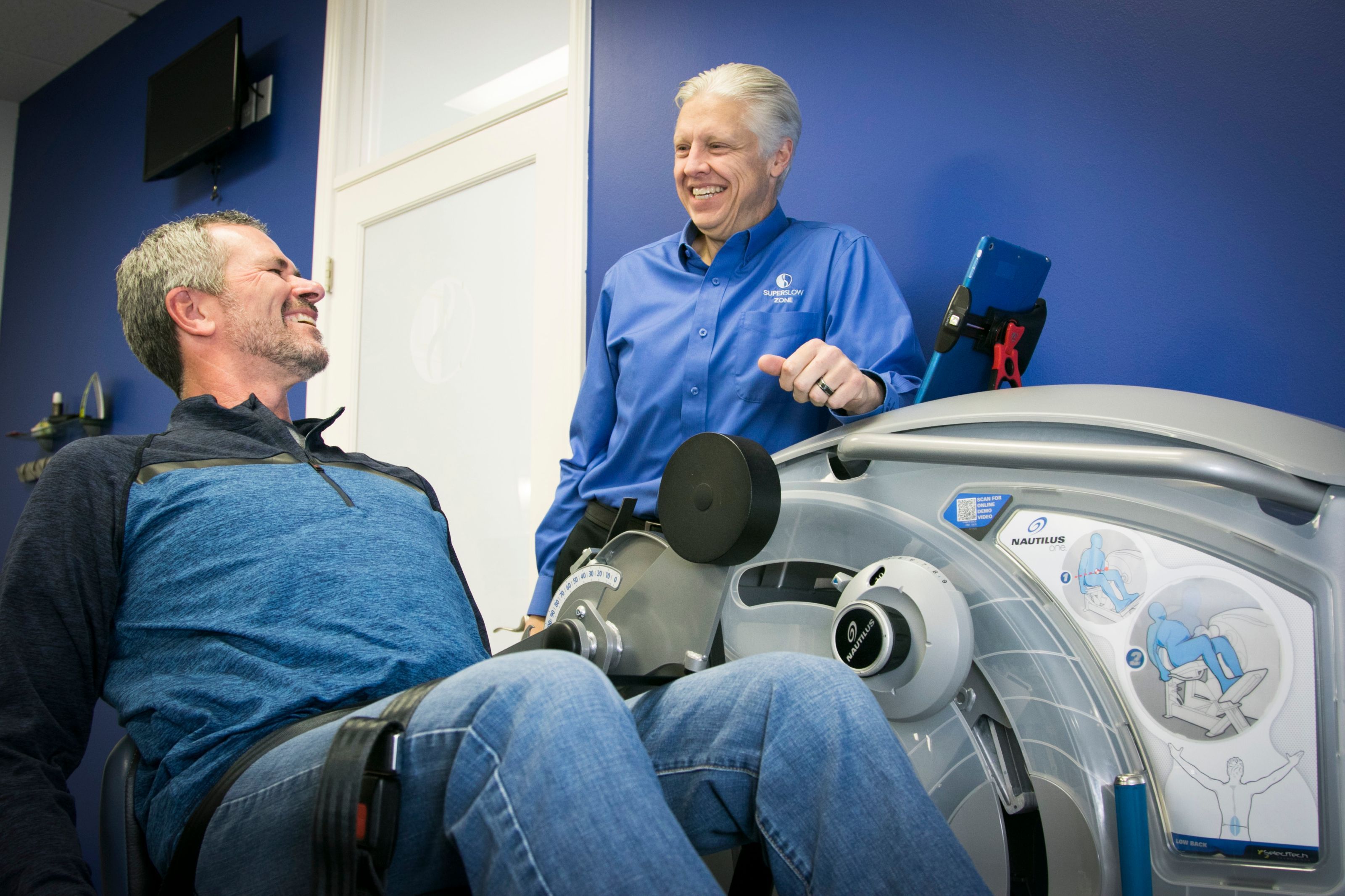 A man training one-on-one with a certified SuperSlow Zone instructor